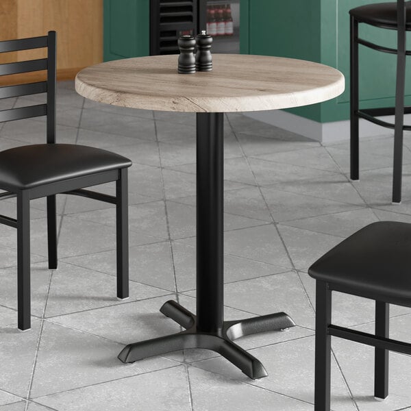 A round 30-inch table with a gray wood finish top and a black metal pedestal base.