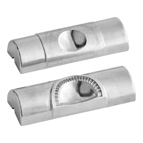 A close-up of a silver semi-circle die.