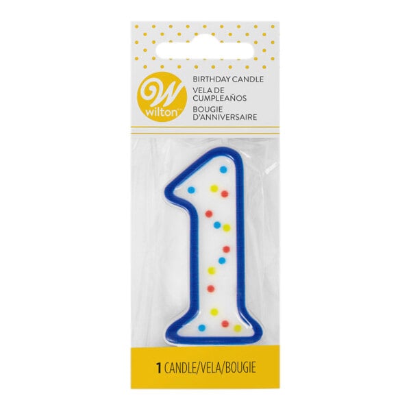 A blue Wilton candle with colorful polka dots in the shape of the number one.