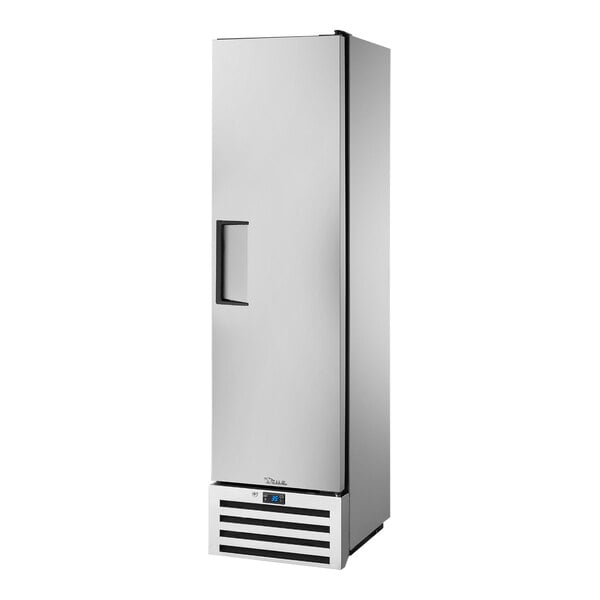 A stainless steel True reach-in refrigerator with black handles on a door.