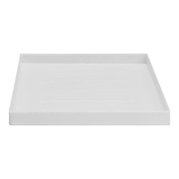 A white square E.L. Mustee Durapan washing machine pan.