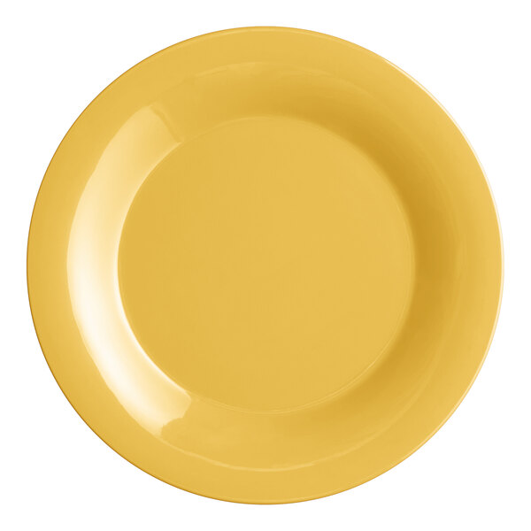 An Acopa Foundations yellow melamine plate with a wide rim.