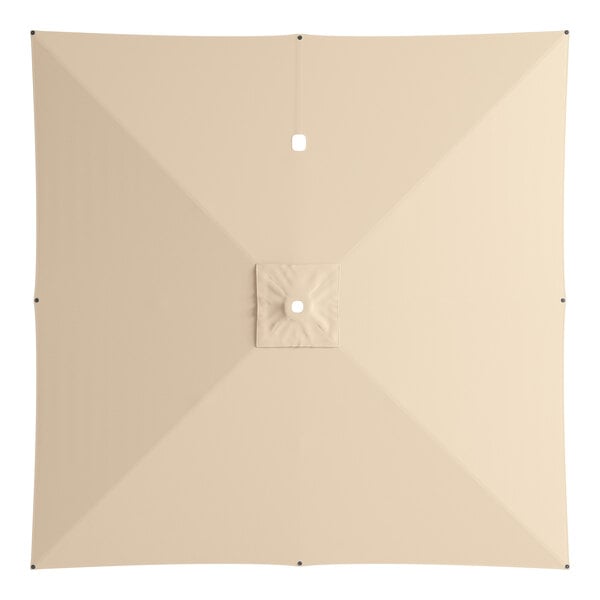 A square beige umbrella canopy for a cantilever umbrella with a square hole in the center.