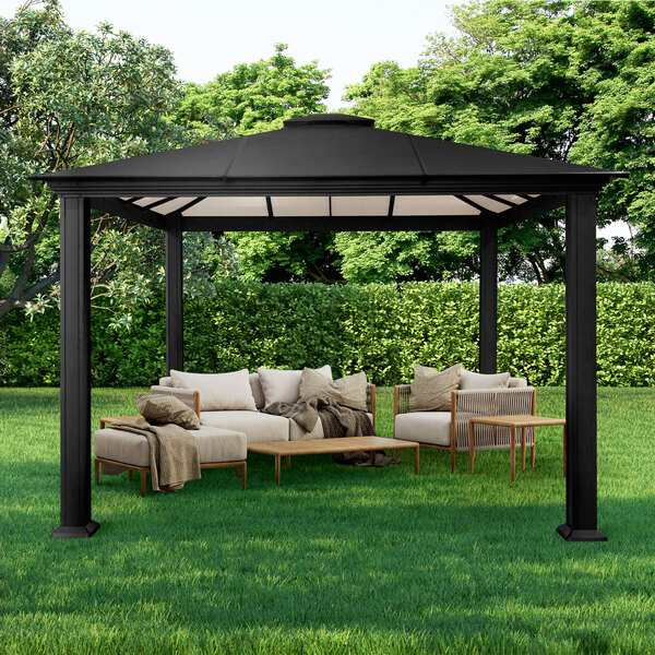 A black Paragon Outdoor Santa Monica gazebo with a table and chairs on grass.