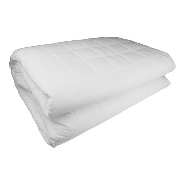 A folded white Oxford mattress pad on a white surface.