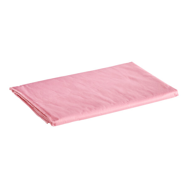 An Oxford pink quilted mattress pad on a white background.