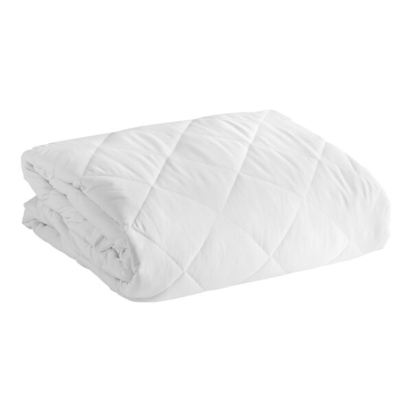 A close-up of a white Oxford mattress pad.