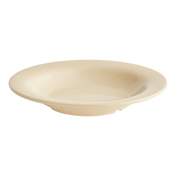 An Acopa Foundations tan melamine bowl with a wide rim.