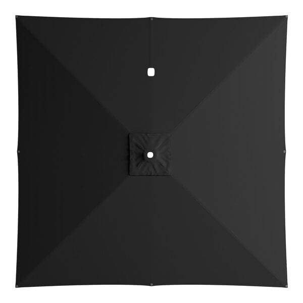 A top view of a black square umbrella with a white circle on top.