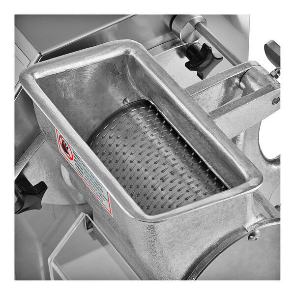 An Estella electric hard cheese grater with a metal grater container.