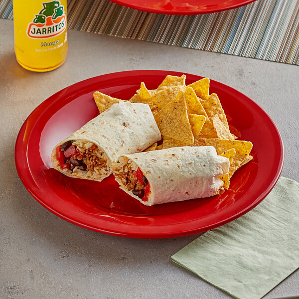 An Acopa Foundations red melamine plate with a burrito and chips on it.