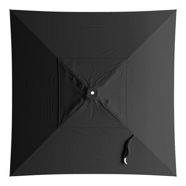 A black umbrella canopy with a white circle on top.