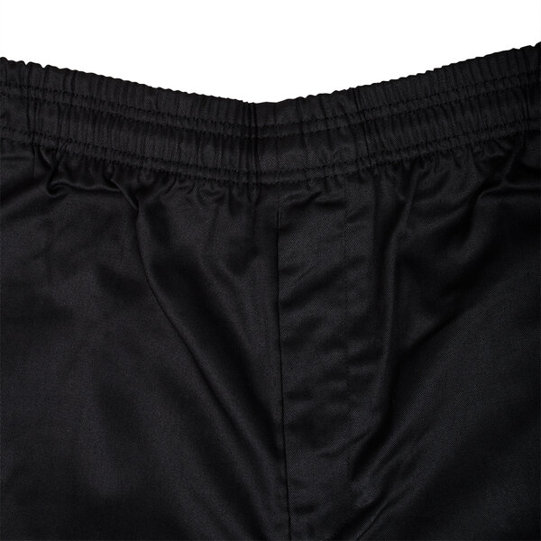 A close up of the front of black Chef Revival cargo pants.