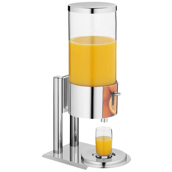 A Hepp stainless steel and plastic juice dispenser with a glass of orange juice.