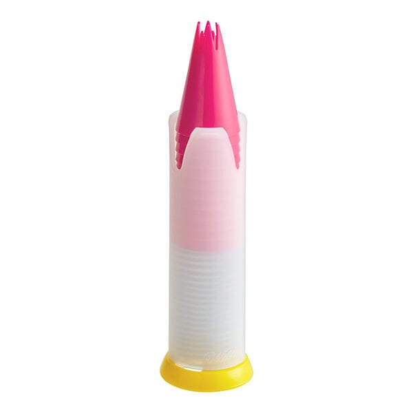 A yellow plastic container with a pink lid and a heart cut out containing 12 plastic piping tips.