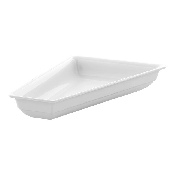 A white triangle shaped dish with a handle.