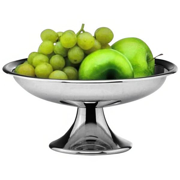 A Hepp silver stainless steel bowl filled with green apples and grapes.