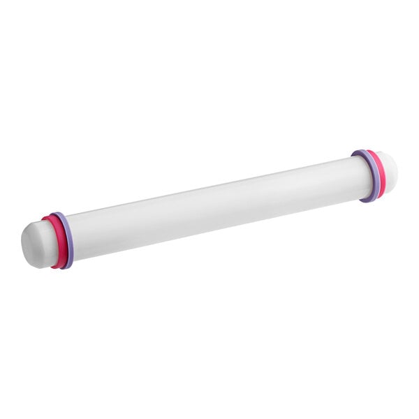 A white plastic tube with purple and pink rubber bands.
