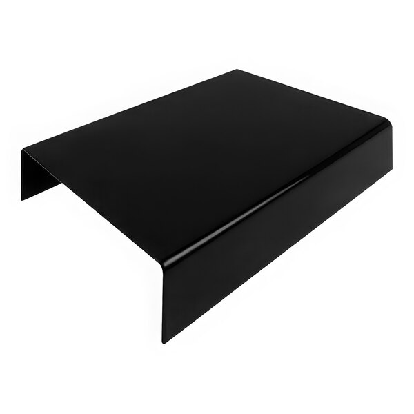 A black rectangular Dalebrook acrylic riser on a white table.