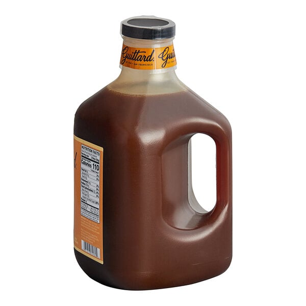 A jug of Guittard Rich and Creamy Caramel Flavoring Sauce.