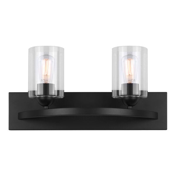 A black Canarm rectangular vanity light with clear glass shades over two light bulbs.