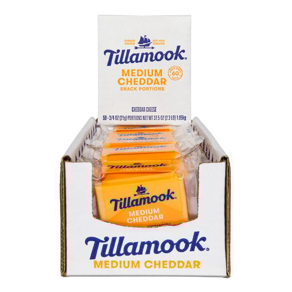 A white Tillamook box with 50 medium yellow cheddar cheese snacks.