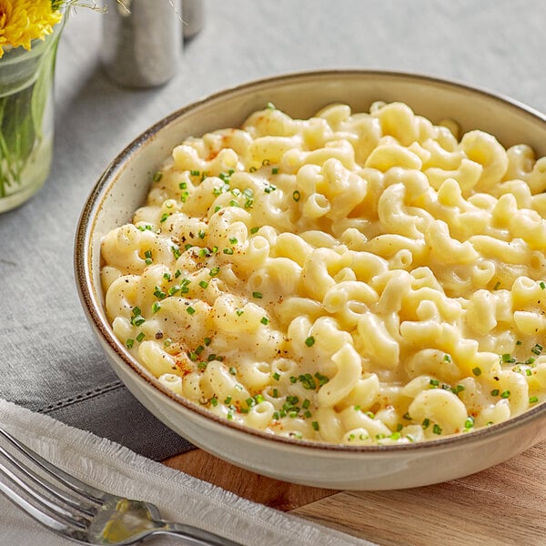 A bowl of macaroni and cheese with Tillamook shredded medium white cheddar cheese.