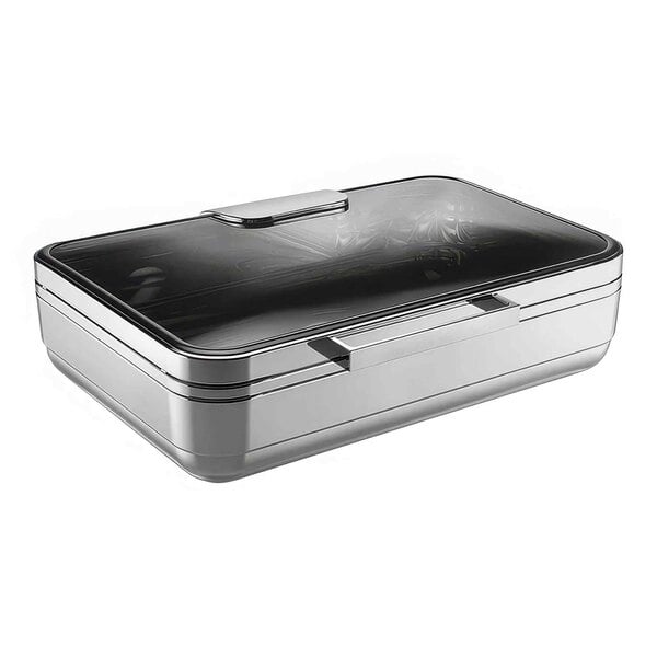 A silver rectangular WMF chafing dish with porcelain inserts on a counter.