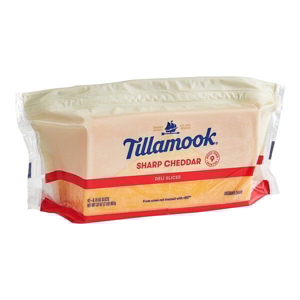A package of Tillamook Deli Sliced Sharp Yellow Cheddar Cheese slices.