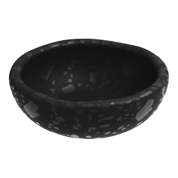 A black ramekin with white specks.