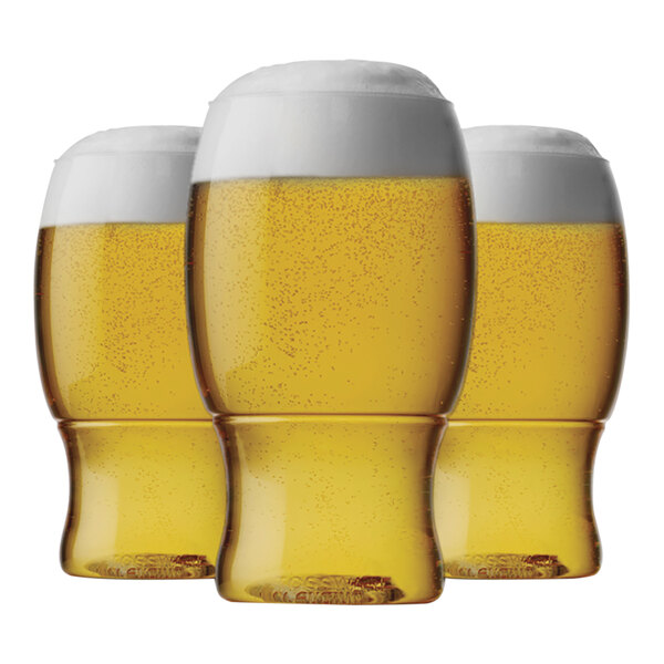 Tossware plastic pint glasses filled with beer on a white background.