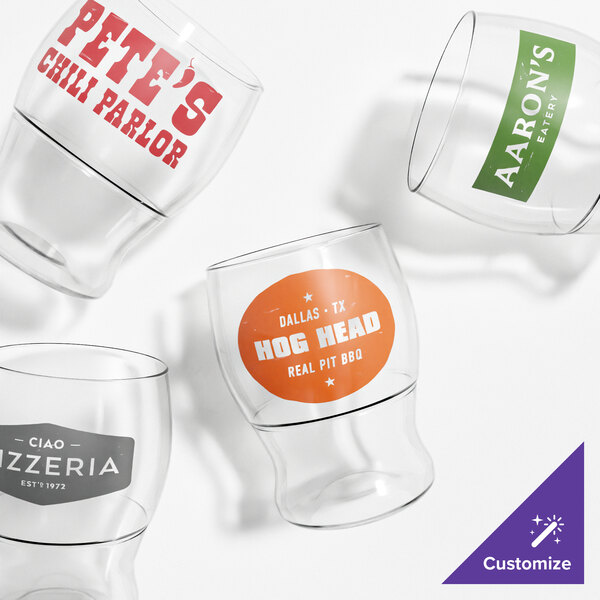 A set of customizable clear plastic pint glasses with various restaurant logos printed on them.