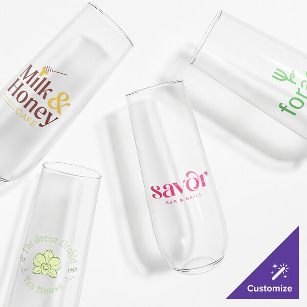 A set of customizable clear plastic champagne flute glasses with various printed logos.