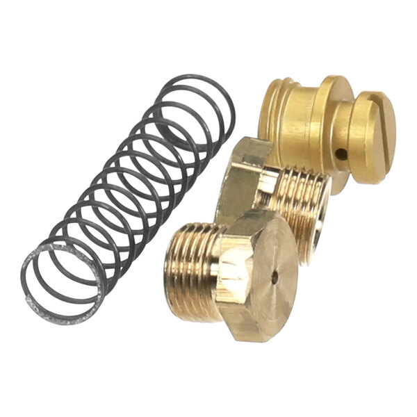 A close-up of AccuTemp natural gas to liquid propane conversion kit brass fittings and a brass valve with a spring.