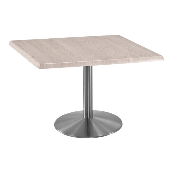 A Holland Bar Stool square table with a stainless steel base.