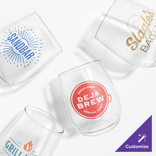 A set of four customizable clear plastic wine glasses with different printed logos and designs.