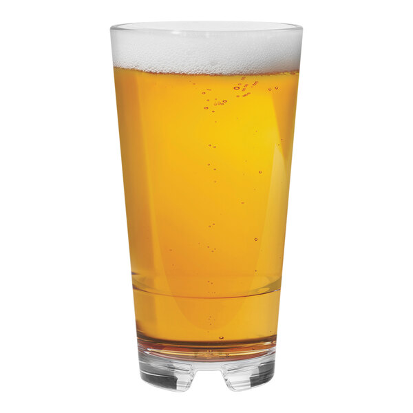 A Tossware Reserve Tritan plastic pint glass filled with beer and foam.