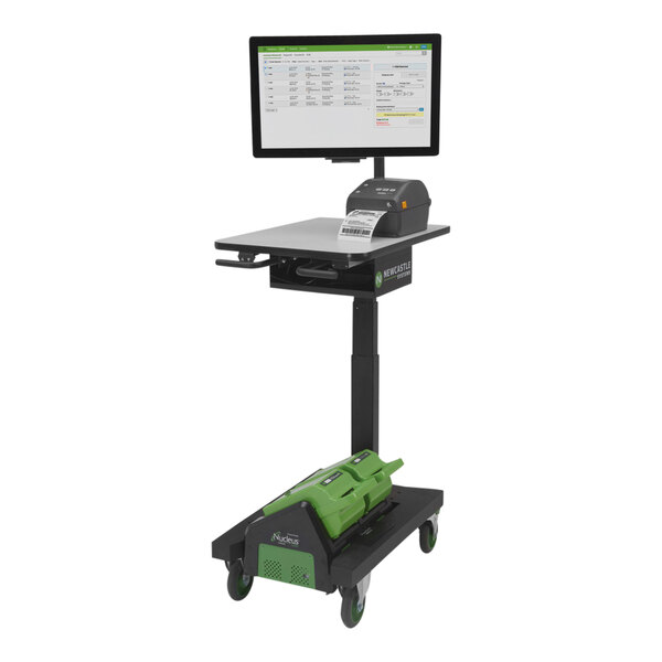 A Newcastle Systems Apex Series sit/stand mobile workstation with a computer on it.