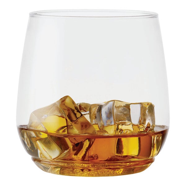 A Tossware plastic Vino Jr. glass filled with ice and amber liquid.