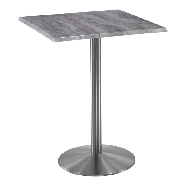 A Holland Bar Stool EnduroTop square table with a metal base and greystone top.