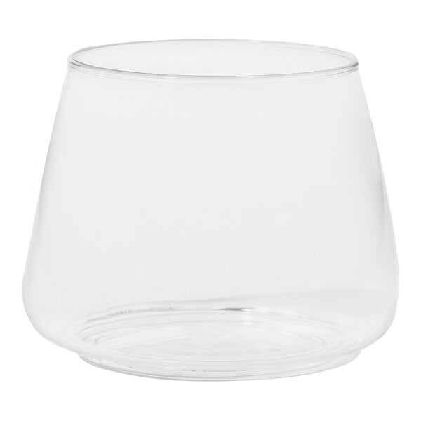 A clear Tossware plastic rocks glass with a round bottom on a white background.
