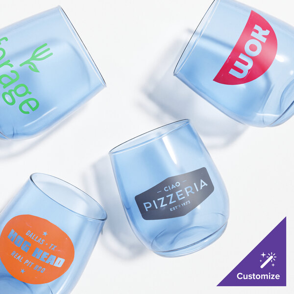 A group of Tossware wine glasses with different colored labels.