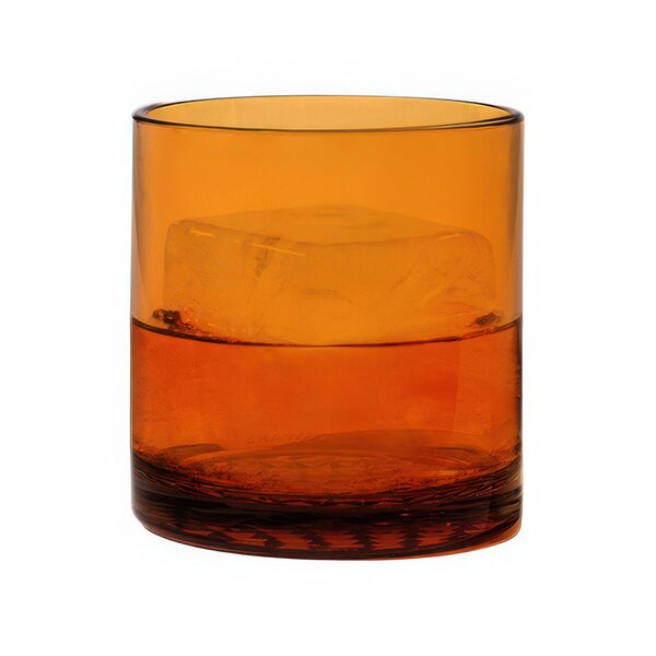 A Tossware Amber Tritan plastic rocks glass filled with ice and orange liquid.