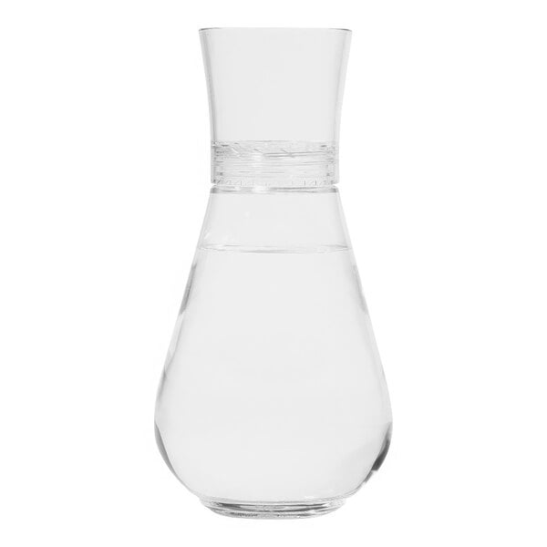 A Tossware clear plastic decanter filled with clear liquid.