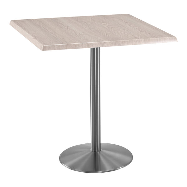 A Holland Bar Stool white ash square table with a stainless steel base.