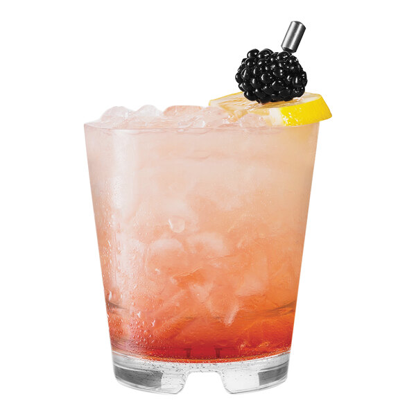 A Tossware Reserve stackable rocks glass with a drink and a blackberry garnish and lemon slice.