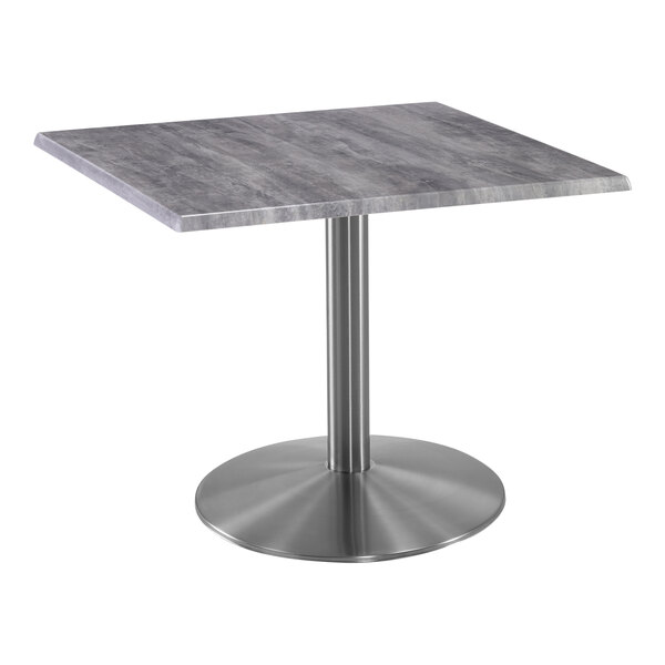 A Holland Bar Stool EnduroTop square table with a stainless steel base and a gray top.