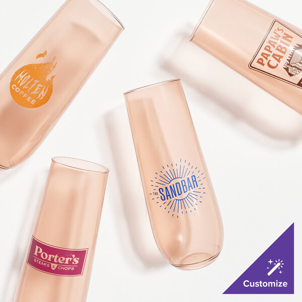 A group of Tossware coral pink champagne flutes.