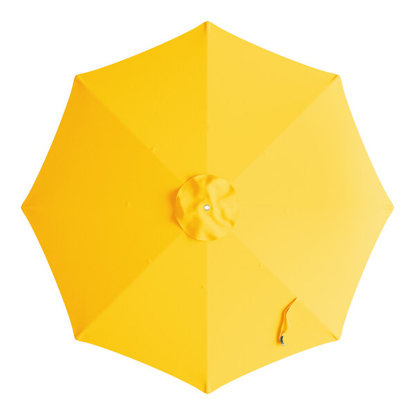 A Lancaster Table & Seating round yellow umbrella canopy with a handle.