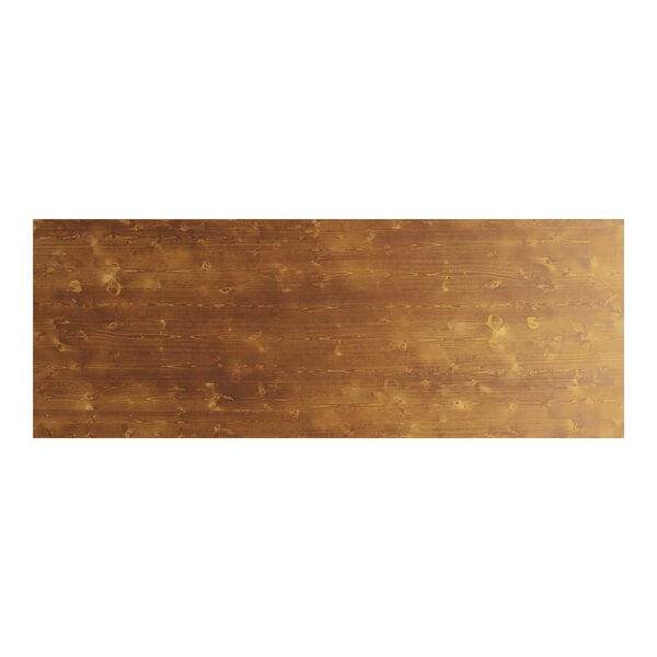 A brown rectangular Lancaster Table & Seating Vineyard Series outdoor folding table top with knots in the wood.